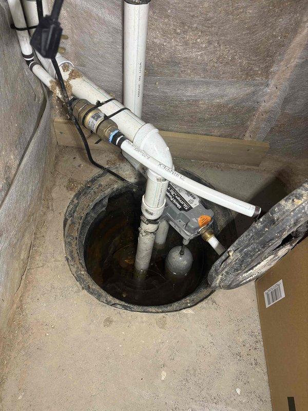 Responded to no hot water call and confirmed water heater was completely non-operational. Upon inspection, determined eight-year-old unit had failed beyond economical repair. Documented existing installation conditions including attic-mounted plumbing configuration with PVC piping system and basement sump pump setup. Customer declined service call and opted to proceed with free water heater replacement estimate instead.