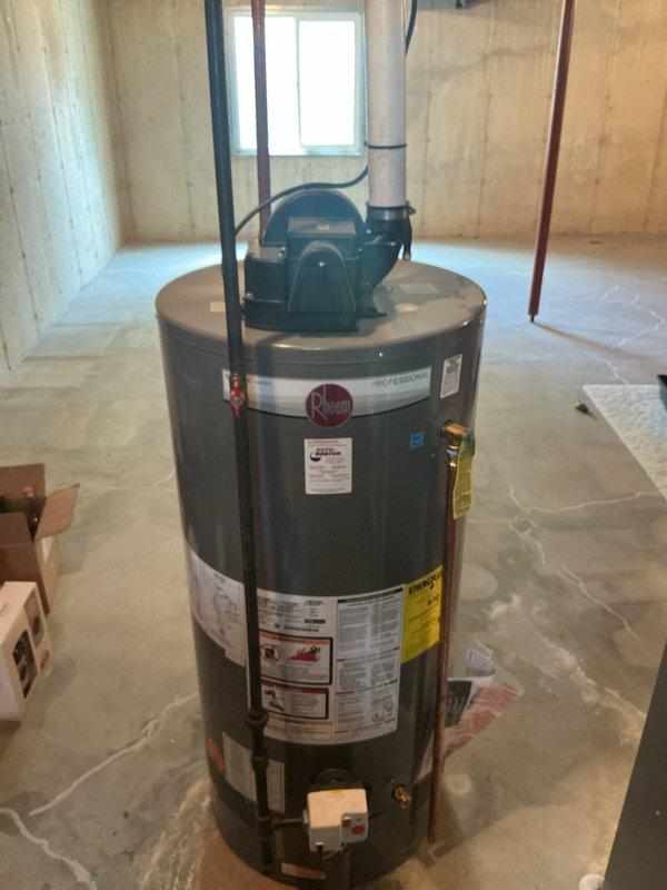 Responded to water leak complaint with pooling under HVAC unit during AC operation. Inspected 15-year-old Lennox condensing unit (Model CX34-43C-6F-1) and found active condensation on equipment surfaces. Documented water accumulation on basement floor beneath furnace/AC system with photographic evidence showing moisture present on unit casing and surrounding area. Identified condensate drainage issue as source of water pooling during cooling cycle operation.