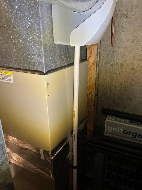 Conducted on-site assessment of 16-year-old residential air conditioning system to provide replacement estimate. Evaluated outdoor condenser unit with visible copper fan assembly and condenser coils, noting age-related weathering and potential undersizing concerns for current structure. Inspected indoor air handler cabinet with condensate drain pan and ductwork connections in basement utility area. Documented existing equipment specifications, installation configuration, and operational capacity to determine proper system sizing requirements. Provided comprehensive replacement options and recommendations for appropriately-sized HVAC equipment to meet heating and cooling demands of residence.