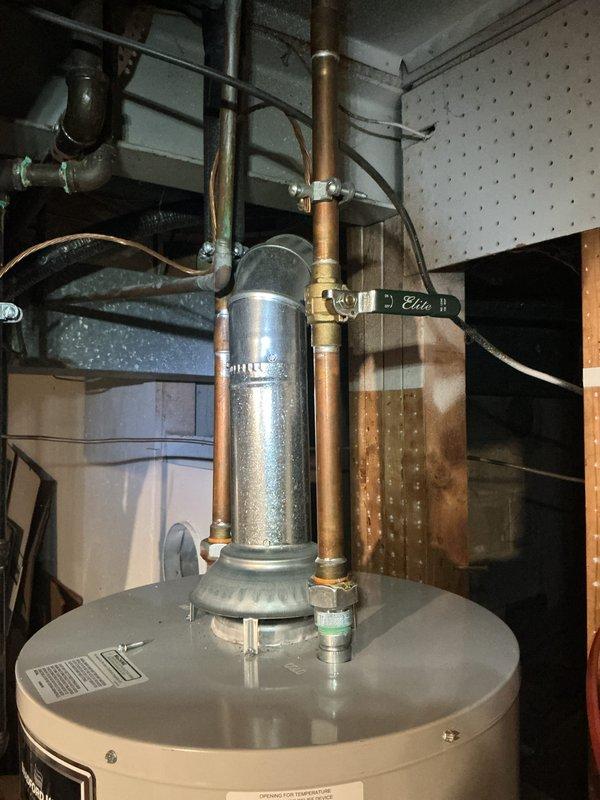 Provided estimate for replacement of existing 6.5-year-old standard water heater with new heat pump water heater unit. Documented current installation including copper supply piping, flue vent assembly, and existing water treatment components. No safety concerns or operational issues reported with current unit at time of assessment.