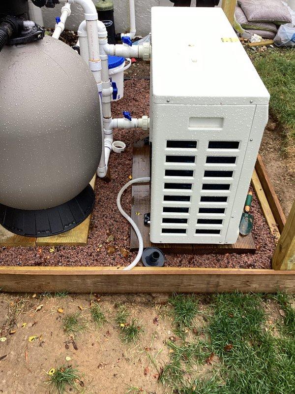 Installed dedicated 240-volt, 20-amp GFCI-protected circuit for AquaStrong Hex075 75,000 BTU heat pump with approximately 60-foot wire run from main panel to pool equipment area. Hardwired unit with external quick-disconnect box per NEC requirements for pool/spa equipment and ran #8 AWG bare copper grounding conductor to ground rod for proper equipment grounding in wet location application.