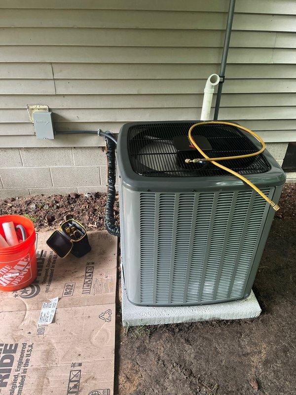 Completed full system installation of new furnace and air conditioning unit. Installed indoor furnace with evaporator coil in basement utility area, including PVC condensate drainage lines and proper venting. Mounted outdoor condenser unit on concrete pad with electrical disconnect box, connected refrigerant lines, and completed all ductwork connections. Verified proper system operation, refrigerant charge, and airflow. All equipment secured, tested, and left in operational condition.