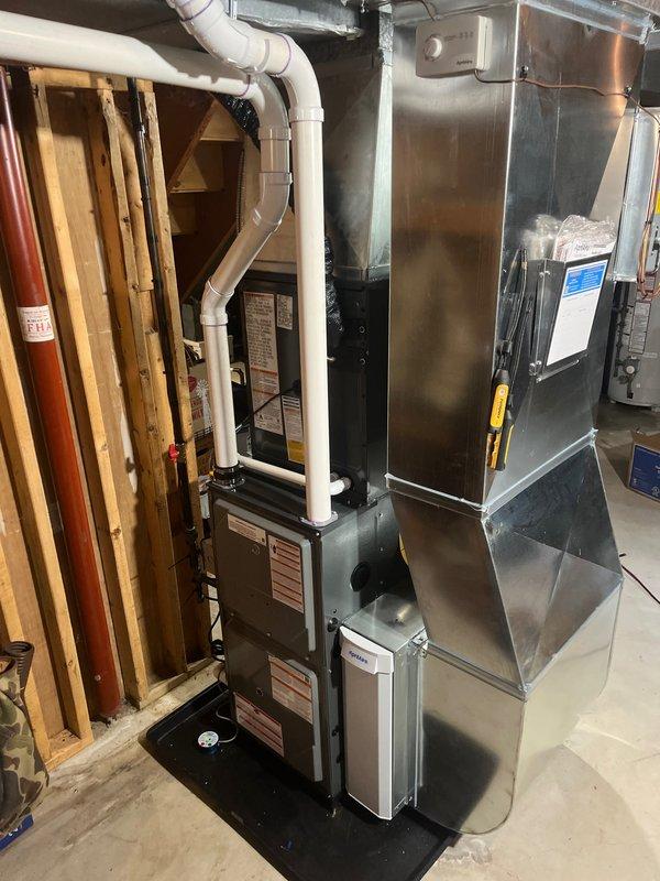 Completed full system installation of new furnace and air conditioning unit. Installed indoor furnace with evaporator coil in basement utility area, including PVC condensate drainage lines and proper venting. Mounted outdoor condenser unit on concrete pad with electrical disconnect box, connected refrigerant lines, and completed all ductwork connections. Verified proper system operation, refrigerant charge, and airflow. All equipment secured, tested, and left in operational condition.