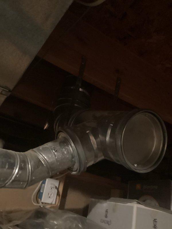 Completed Plumbing Club Inspection for 2022 construction management property. Documented water heater installation in utility room, verifying proper copper supply line connections and metal flue pipe configuration. Inspected attic HVAC ductwork installation, confirming flexible metallic ducting is properly secured and routed through ceiling joists with appropriate clearances from electrical components.