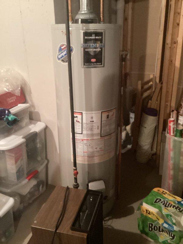 Completed Plumbing Club Inspection for 2022 construction management property. Documented water heater installation in utility room, verifying proper copper supply line connections and metal flue pipe configuration. Inspected attic HVAC ductwork installation, confirming flexible metallic ducting is properly secured and routed through ceiling joists with appropriate clearances from electrical components.