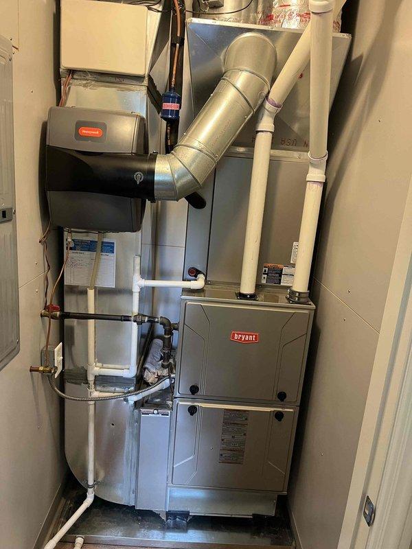 Completed comprehensive ASTU-AC Super Tune-up service on two 11-year-old Bryant air conditioning systems. Upon inspection, discovered significant dust, lint, and debris accumulation on evaporator coil fins, which was restricting airflow and reducing system efficiency. Thoroughly cleaned and serviced both units, including evaporator coils, condensate drainage systems, and all operational components. Verified proper operation of humidifier unit and associated connections. Both systems are now operating at optimal performance levels with restored airflow and efficiency.