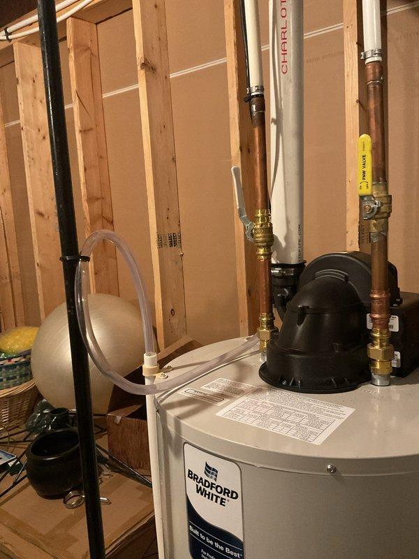Responded to callback for recently installed Bradford White water heater where building inspector identified a kinked flexible water line during inspection. Returned to site and replaced the kinked line with proper copper piping and brass fittings to meet code requirements. Verified all connections for proper flow and tested system operation. Installation now passes inspection standards with no leaks detected.
