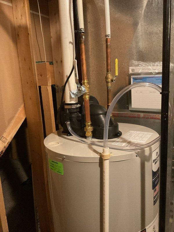 Responded to callback for recently installed Bradford White water heater where building inspector identified a kinked flexible water line during inspection. Returned to site and replaced the kinked line with proper copper piping and brass fittings to meet code requirements. Verified all connections for proper flow and tested system operation. Installation now passes inspection standards with no leaks detected.