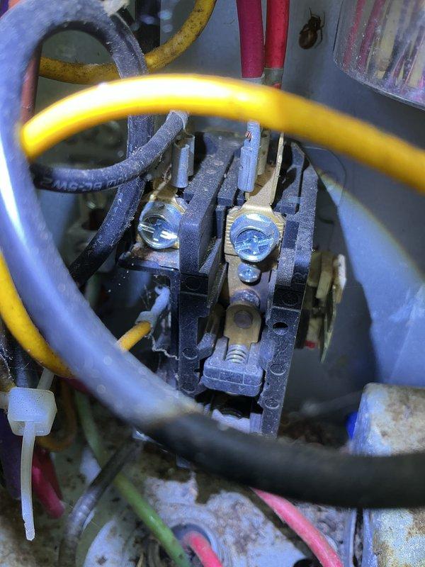 Completed annual cooling maintenance on 11-year-old EnergiAir system. Inspected electrical contactor and control circuit connections, noting normal wear and dust accumulation on components. Checked condensate drain pan for proper operation and drainage. All electrical connections secure with appropriate wire routing. System operational and ready for cooling season.