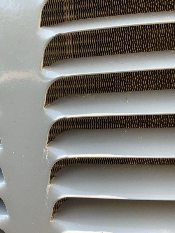 Responded to no-cooling complaint on residential air conditioning system. Upon inspection, found evaporator coil with moderate dust and debris accumulation affecting airflow and heat transfer efficiency. Cleaned evaporator coil fins and grille assembly, removed obstructions from ventilation components, and verified proper airflow restoration. System tested and confirmed cooling to setpoint temperature upon completion.