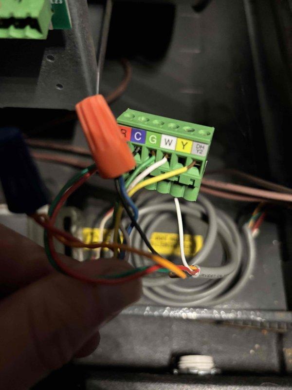 Responded to no cooling complaint where system would not activate. Upon inspection, found loose wiring connections at the thermostat terminal block within the control panel. Tightened and secured all wire terminations at C, G, W, and Y terminals. Verified proper wire routing and connections throughout the electrical enclosure. Tested system operation and confirmed unit now cycles on properly with normal functionality restored.