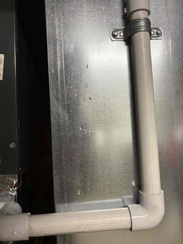 Responded to water leak service call where system had shut down due to water in the evaporator pan. Upon inspection, discovered evaporator coil with heavy frost and ice accumulation, indicating a freeze-up condition that caused excessive condensation and pan overflow. Replaced faulty evaporator pan float switch that had triggered system shutdown as designed to prevent water damage. Addressed underlying freeze-up issue by checking airflow restrictions and system operation. Verified proper drainage through condensate line and PVC piping system. System restored to normal operation with proper safety controls functioning.