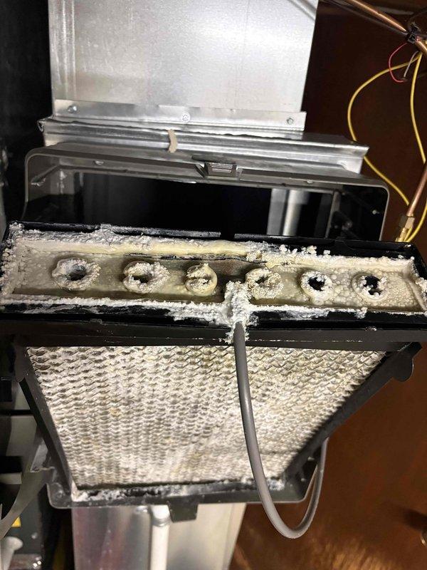 Responded to water leak service call where system had shut down due to water in the evaporator pan. Upon inspection, discovered evaporator coil with heavy frost and ice accumulation, indicating a freeze-up condition that caused excessive condensation and pan overflow. Replaced faulty evaporator pan float switch that had triggered system shutdown as designed to prevent water damage. Addressed underlying freeze-up issue by checking airflow restrictions and system operation. Verified proper drainage through condensate line and PVC piping system. System restored to normal operation with proper safety controls functioning.