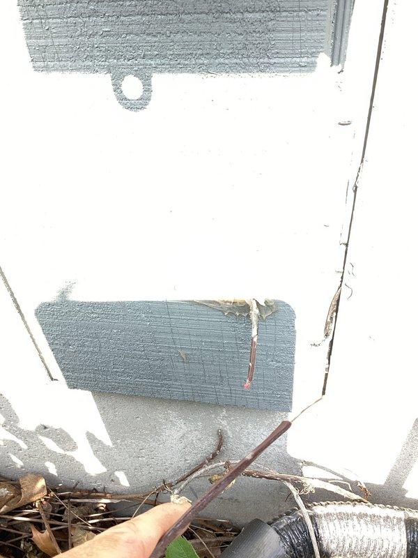 Responded to service call for 9-year-old air conditioning system displaying error code after customer had replaced furnace filter, cleaned exterior coils, and installed iFlo device. Upon arrival, performed diagnostic evaluation of system components. Inspected interior ductwork and insulation for proper installation and airflow restrictions. Examined exterior condensing unit base and surrounding area, noting vegetation growth and moisture accumulation around equipment foundation. Identified and resolved error code issue through system diagnostics and component testing. Verified proper system operation, airflow, and refrigerant cycle functionality. Unit restored to normal cooling operation.