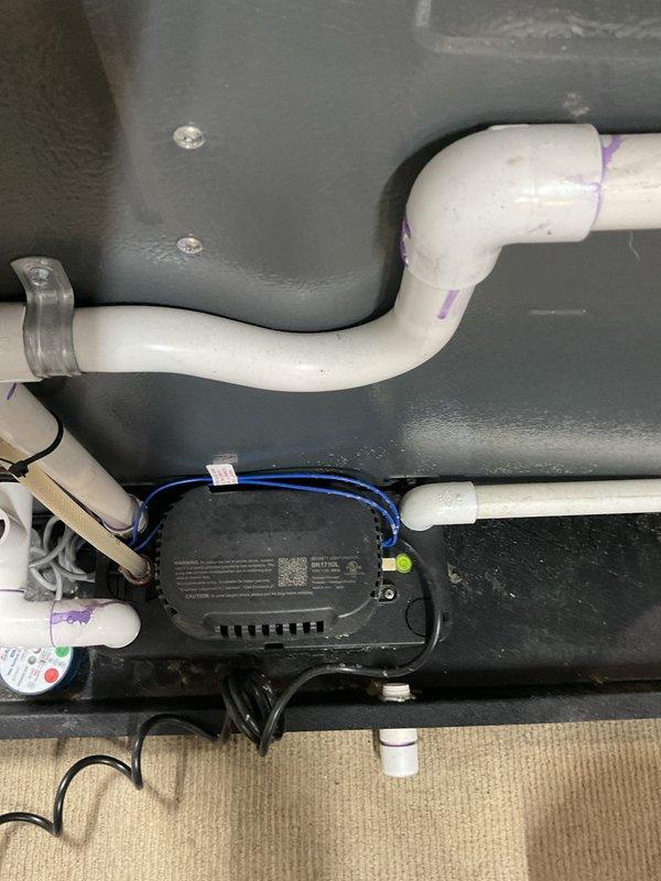 Completed annual heating and cooling maintenance visit on 4-year-old Heil system including furnace, air conditioning unit, and humidifier. Inspected condensate drainage system with PVC trap configuration and condensate pump assembly, confirming proper operation and secure connections. Performed routine maintenance checks on all HVAC components per manufacturer specifications, verified system operation, and documented equipment condition with photographic records.
