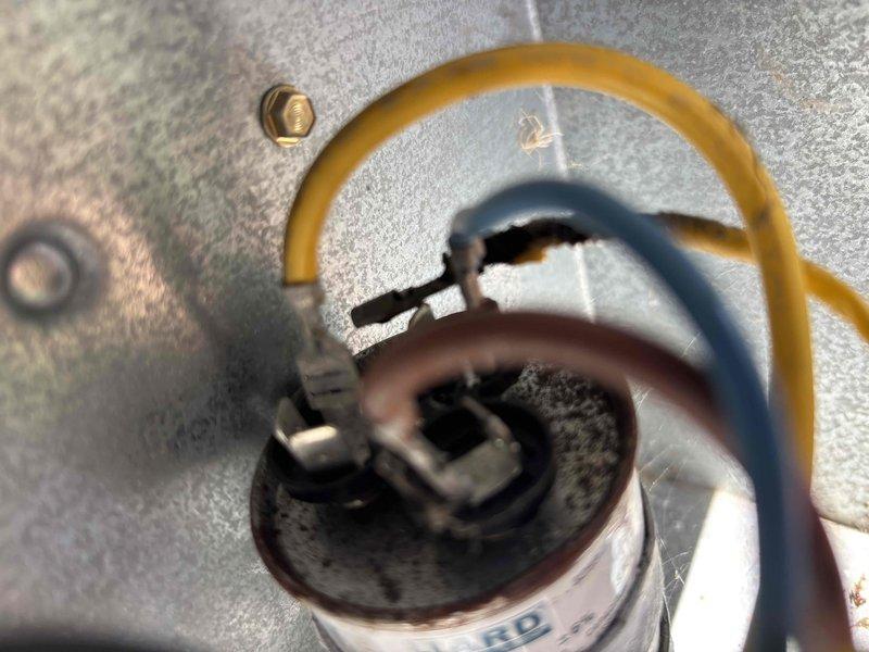 Responded to no cooling call on 24-year-old Bryant air conditioning system with complete failure of all components. Upon inspection, discovered severely corroded and damaged wire connector at capacitor terminal, preventing power delivery to outdoor unit. Replaced failed connector and verified proper electrical connections throughout system. Tested unit operation and confirmed compressor, condenser fan motor, and all components restored to normal function with proper cooling achieved.