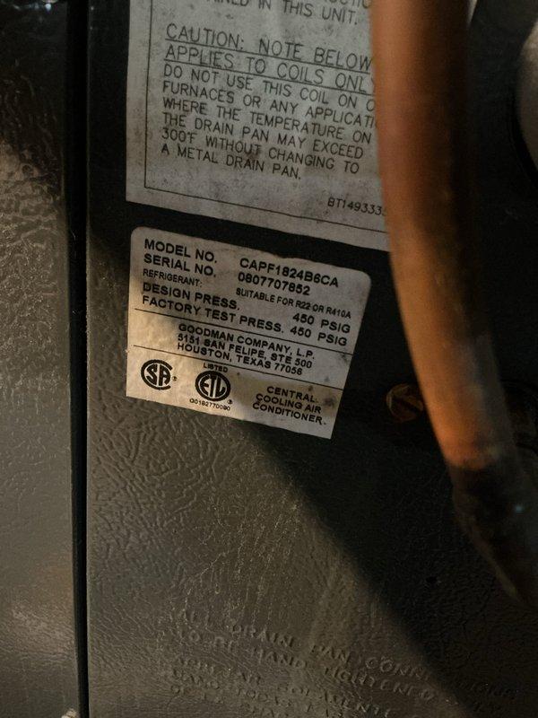 Responded to no cooling complaint on 15-year-old Goodman CAPF1624ABCCA air conditioning system. Customer reported thermostat set to 64°F but indoor temperature exceeded 80°F with no temperature reduction. Performed diagnostic inspection of outdoor condensing unit and verified equipment model and serial number. Unit is R22/R410A compatible system rated at 450 PSIG design pressure. Documented equipment condition and configuration for service records. System requires further troubleshooting to identify root cause of cooling failure, which may include refrigerant charge verification, compressor operation testing, airflow assessment, and electrical component diagnostics.