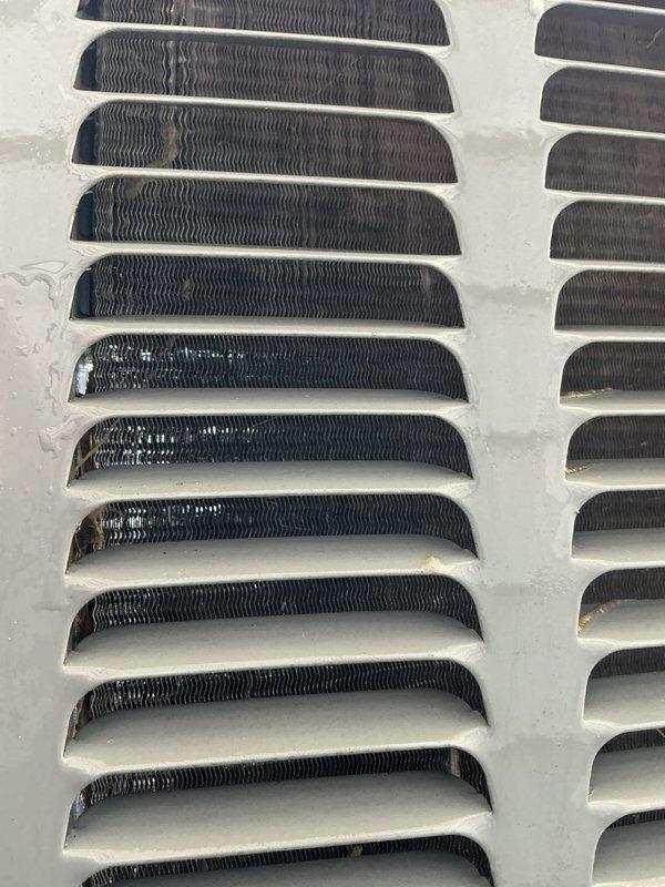 Completed annual cooling maintenance on 2-year-old Payne system (2022 model). Inspected air return vents and grilles, noting significant dust and debris accumulation on louvers and internal fins requiring attention for optimal airflow and system efficiency. Performed standard tune-up procedures to ensure proper operation for the cooling season.