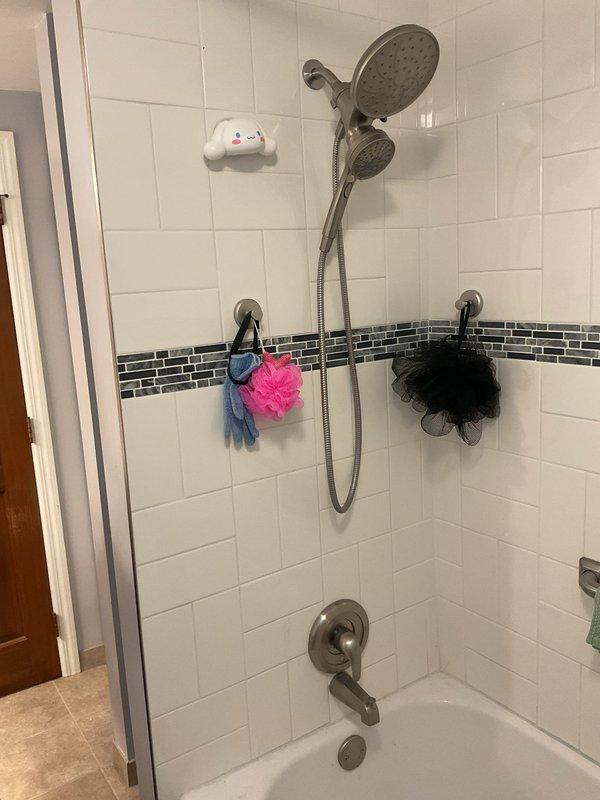 Responded to complaint of water hammer occurring after previous plumbing service. Investigated knocking sounds in tub pipes when faucets were operated and toilet flushed. Inspected bathroom plumbing system, including tub spout, shower fixtures, and supply lines. Diagnosed water hammer condition caused by loose pipes or missing air chambers. Secured water supply lines and verified proper pipe mounting to eliminate movement. Tested all fixtures including tub faucet, sink faucet, and toilet to confirm knocking sounds were resolved. System operating normally with no water hammer present upon completion.