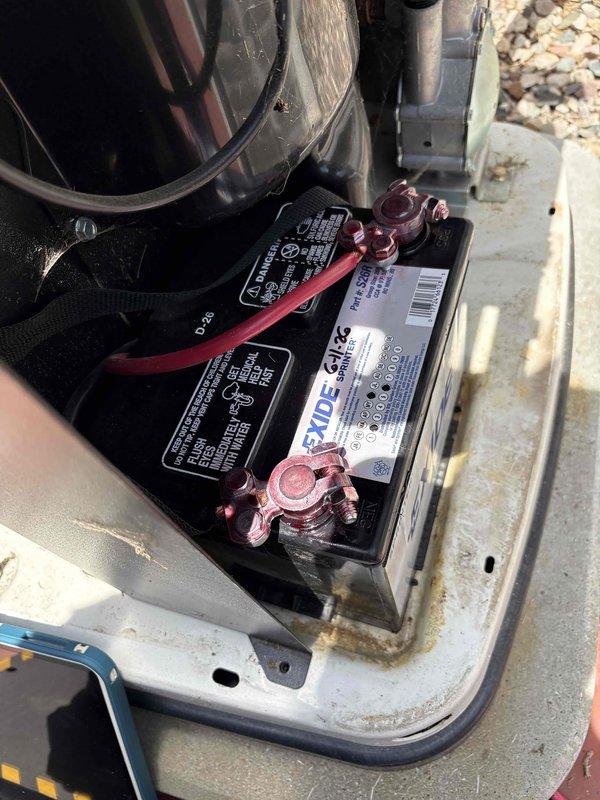 Completed comprehensive generator tune-up service on 2023 unit, including full system inspection of mechanical and electrical components. Documented battery condition showing Exide unit with proper terminal connections and clean posts, and verified blower assembly, motor, valve components, and ductwork all operating within normal parameters.