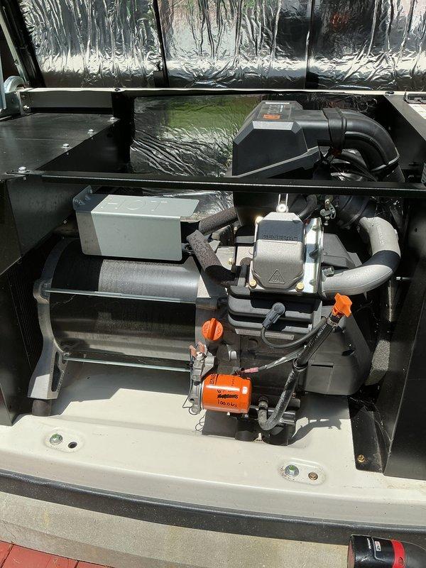 Completed comprehensive generator tune-up service on 2023 unit, including full system inspection of mechanical and electrical components. Documented battery condition showing Exide unit with proper terminal connections and clean posts, and verified blower assembly, motor, valve components, and ductwork all operating within normal parameters.