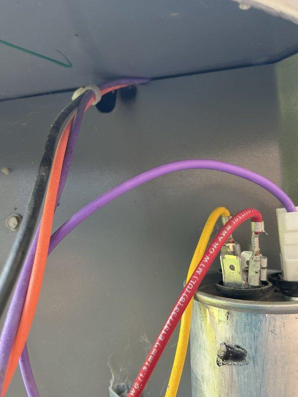 Responded to no-cooling complaint following recent tune-up on 10-year-old Lennox system. Upon inspection, found failed dual run capacitor with visible discoloration and staining on metallic casing. Replaced defective capacitor, verified proper wire connections, and tested system operation. Unit restored to normal cooling capacity with all electrical components functioning within manufacturer specifications.