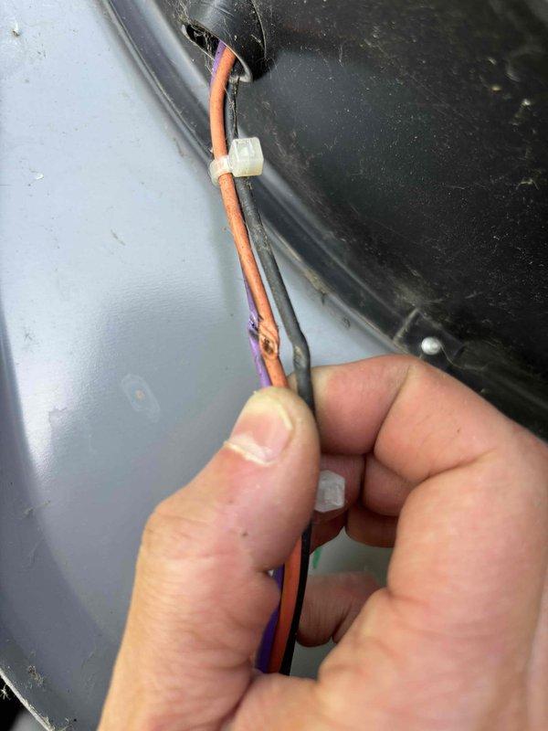 Responded to no-cooling complaint following recent tune-up on 10-year-old Lennox system. Upon inspection, found failed dual run capacitor with visible discoloration and staining on metallic casing. Replaced defective capacitor, verified proper wire connections, and tested system operation. Unit restored to normal cooling capacity with all electrical components functioning within manufacturer specifications.