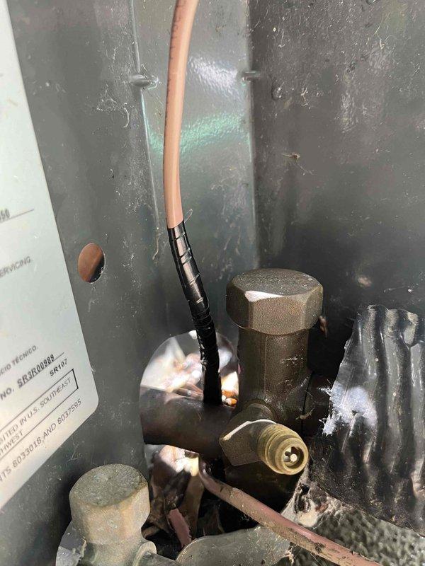 Completed comprehensive AC Super Tune-up on 4-year-old unit. Inspected and serviced refrigerant lines, valves, and copper tubing connections in basement mechanical system. Customer reported inadequate cooling upstairs with basement remaining excessively cold, indicating potential airflow distribution or zoning issues. Prepared for future installation of customer-provided Wi-Fi thermostat to improve temperature control and system efficiency throughout home.
