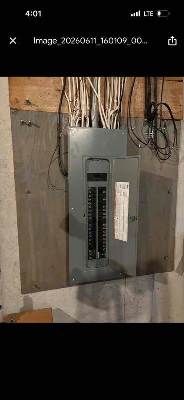 Completed 200-amp electrical service upgrade including coordination with utility company for temporary power disconnect and reconnect. Installed new electrical panel with circuit breakers in basement utility area, upgraded exterior meter base and service entrance conductors with proper conduit installation on exterior wall. Obtained electrical permit PE26-0124 and coordinated required inspection. All work performed to current NEC standards with power successfully restored following completion.