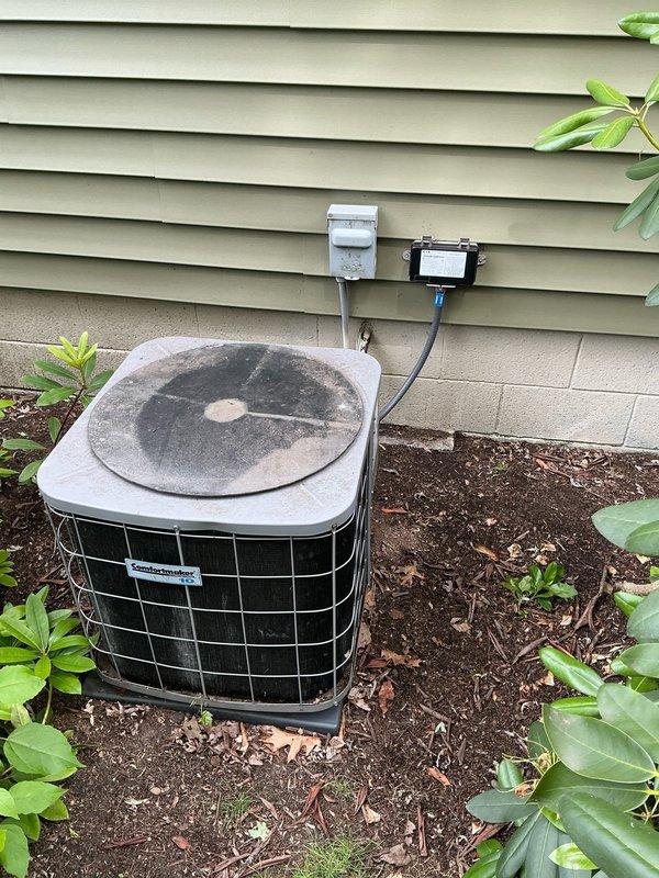 Completed estimate for aging but operational furnace and air conditioning system. Inspected basement-installed gray metal furnace with exposed internal components and high-efficiency white PVC intake/exhaust venting showing dust accumulation, and evaluated outdoor condenser unit with protective wire cage, heavily soiled top cover, wall-mounted disconnect and controls, situated on concrete pad with landscaping. Provided replacement recommendations for both heating and cooling equipment based on age and condition assessment.
