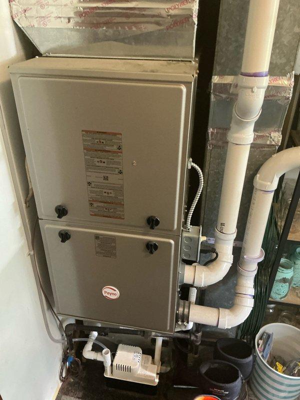 Completed estimate for adding air conditioning system to existing heating installation. Assessed current Payne furnace setup in utility area with existing condensate pump and PVC drainage system to determine optimal integration points for new AC components. Documented equipment placement, available space for coil installation, and existing infrastructure to prepare comprehensive proposal for system addition.