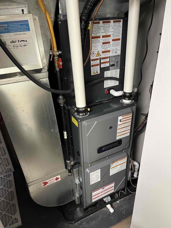 Responded to no-cool condition on EnergiAir system affecting entire home. Customer reported unit not activating after being away for one week, with thermostat displaying Wi-Fi/connection-related message. Upon arrival, inspected furnace and control board assembly in basement utility area. Evaluated system wiring connections, control board components, and thermostat communication pathway. Addressed connectivity issue between thermostat and HVAC control board that prevented system operation. Restored proper communication protocol, verified all wire terminations at control board connectors, and confirmed system response to thermostat commands. Cycled system through complete startup sequence to ensure proper operation. Unit now cooling normally with all functions restored.