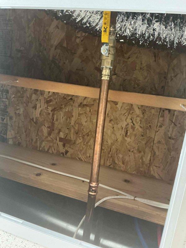 Responded to plumbing leak in basement where a brass valve on copper piping was actively leaking. Inspected the valve assembly located in crawl space area, identified corrosion and verdigris buildup on valve body and connections indicating prolonged moisture exposure. Repaired or replaced the faulty valve, tested system for proper operation and verified leak was eliminated.