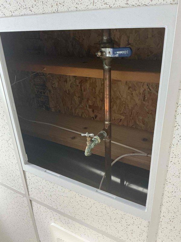 Responded to plumbing leak in basement where a brass valve on copper piping was actively leaking. Inspected the valve assembly located in crawl space area, identified corrosion and verdigris buildup on valve body and connections indicating prolonged moisture exposure. Repaired or replaced the faulty valve, tested system for proper operation and verified leak was eliminated.