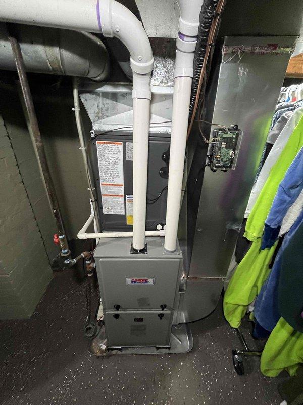 Completed full add-on air conditioning system installation to existing forced-air heating system. Installed new outdoor condensing unit on concrete pad with proper clearances from structure, connected refrigerant lines and electrical service. Added evaporator coil to existing furnace plenum in basement mechanical room, integrated condensate drainage via PVC piping, and established proper venting configuration. Tested system operation, verified proper refrigerant charge and airflow, confirmed all electrical connections meet code requirements.