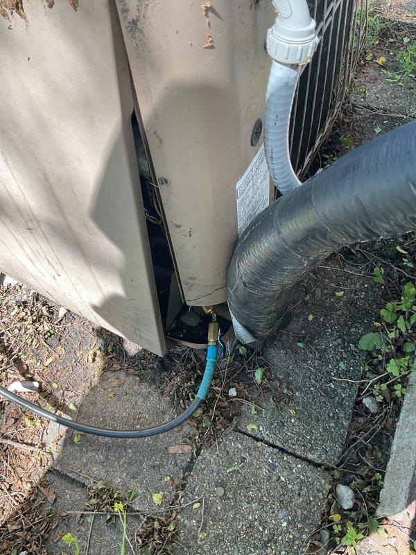 # NC-No Cool Service Call

Responded to no cooling complaint on 1998 Lennox air conditioning system that displayed "cool" mode but failed to produce conditioned air. Upon arrival, performed visual inspection of outdoor condenser unit, which showed significant age-related deterioration including surface rust, discoloration, and accumulated dirt and debris on top panel and fan assembly. Documented existing conditions with photographs showing weathered cabinet, refrigerant line connections, electrical conduit, PVC condensate drain, and overall installation setup on deteriorated concrete pad with vegetation growth.

Given the 27-year age of the equipment and the system's failure to cool despite thermostat indicating cooling mode, conducted diagnostic assessment of the outdoor unit. The condenser showed clear signs of extended outdoor exposure and minimal maintenance over its service life. Refrigerant lines, electrical connections, and drainage components were visually inspected and photogr