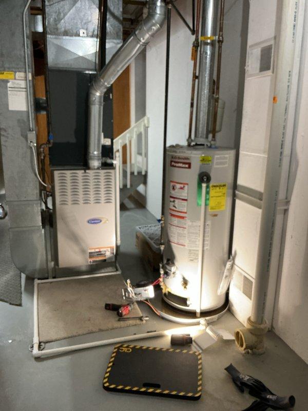 Responded to service call for leaking 15-year-old A.O. Smith ProMax water heater. Upon inspection, found active water leak requiring immediate attention. Due to age of unit and extent of leak, recommended and performed complete water heater replacement to prevent further water damage to basement area.