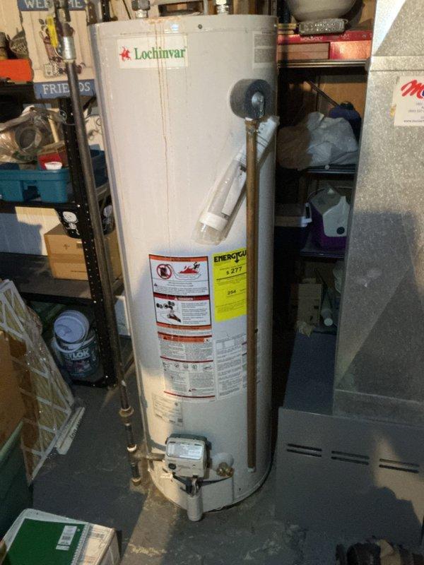 Completed comprehensive AC Super Tune-up on 12-year-old system. During inspection, discovered significant rust-colored sediment and debris accumulation in condensate drain pan, indicating long-term buildup and potential drainage issues. Cleaned and flushed drain pan, removed accumulated sediment, and verified proper condensate drainage to prevent future overflow and water damage.
