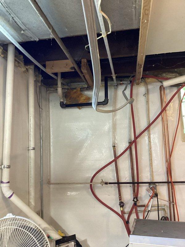 Completed whole house water supply repipe in one day with customer without water. Removed existing water distribution system and installed new copper piping throughout the residence, running supply lines through basement utility space to service all fixtures. All new piping secured with proper mounting brackets and hangers, routed through floor joists and along walls to maintain clearance from electrical systems and HVAC ductwork. System tested and confirmed operational with no leaks detected.