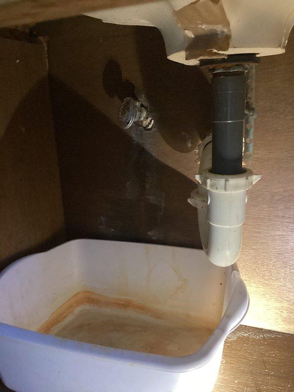 Responded to emergency service call for small leak at upstairs bathroom sink hot water supply connector. Upon arrival, found hot water shut off to fixture. Inspected under-sink plumbing and identified compromised hot water supply line connection causing active leak. Repaired faulty connector, restored hot water supply to sink, tested system for proper operation and verified no additional leaks present.