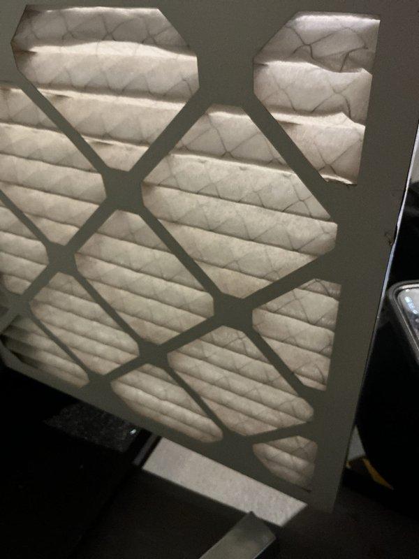 Completed annual cooling maintenance on 2021 EnergiAir system. Inspected and photographed air filter showing clean condition with proper airflow. Verified refrigerant lines, condensate drainage system, and safety float switch operation with all components functioning within normal parameters.