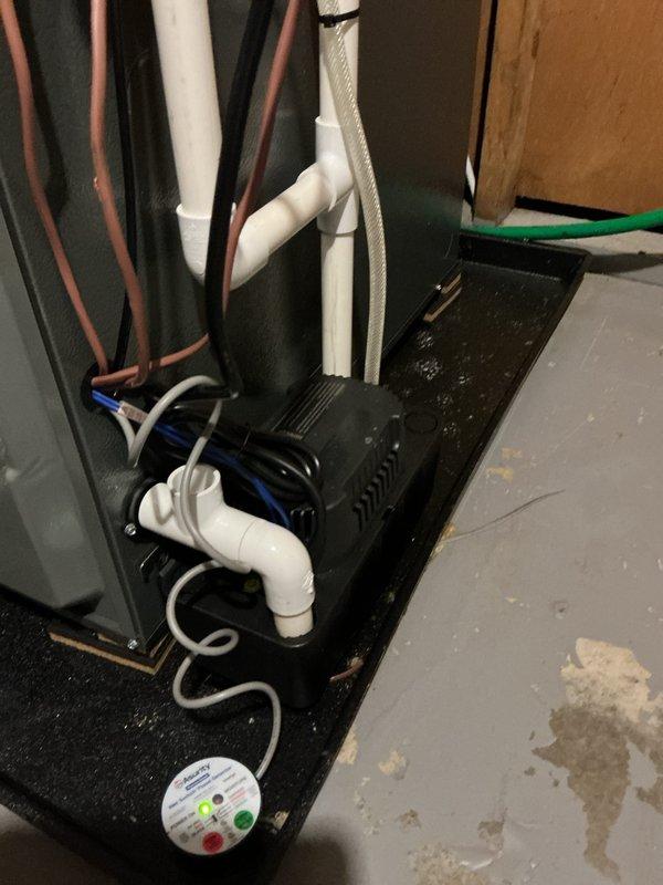 Completed annual cooling maintenance on 2021 EnergiAir system. Inspected and photographed air filter showing clean condition with proper airflow. Verified refrigerant lines, condensate drainage system, and safety float switch operation with all components functioning within normal parameters.