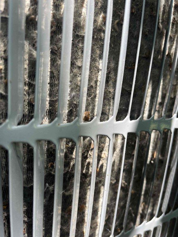 Responded to no cooling call on six-year-old Carrier unit with complete system failure affecting entire home. Upon inspection, discovered outdoor condenser coil heavily clogged with dense accumulation of dirt, dust, lint, and fibrous debris significantly restricting airflow and preventing proper heat transfer. Performed thorough coil cleaning to remove blockage and restore system operation. Unit tested and confirmed cooling restored to normal operating parameters.