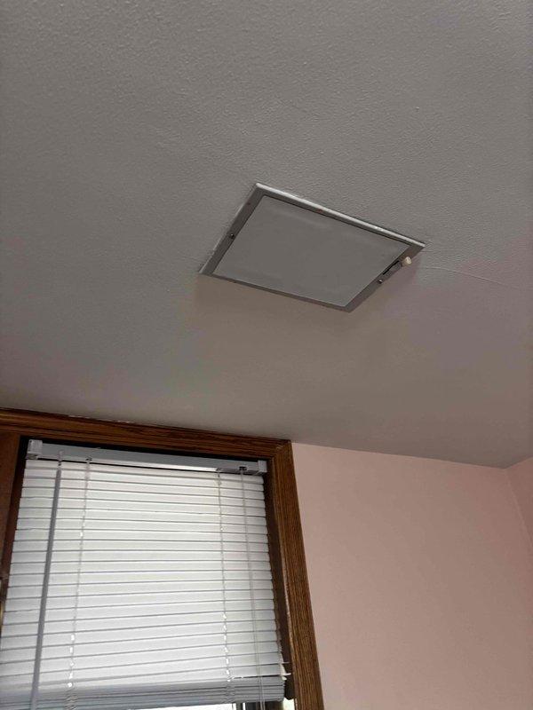 Responded to no cooling complaint and performed system inspection. Upon arrival, found ceiling-mounted air handler access panel improperly secured. Inspected unit through access opening, checked refrigerant levels, electrical connections, and airflow. Secured access panel properly to ensure adequate return air pathway and prevent system inefficiency. Verified unit operation and confirmed cooling restored to normal parameters.