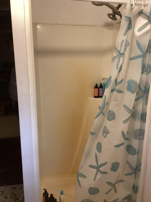 Responded to service call for bathroom plumbing assessment involving multiple fixtures. Evaluated existing toilet condition and determined replacement requirements. Inspected shower stall showing signs of age-related discoloration and yellowing on lower wall surfaces, assessed for potential replacement needs. Examined non-functional jacuzzi tub motor; advised client that repair may not be cost-effective given their consideration of complete bathroom remodel. Documented all fixtures and current bathroom conditions with photographs for client review and future planning purposes.
