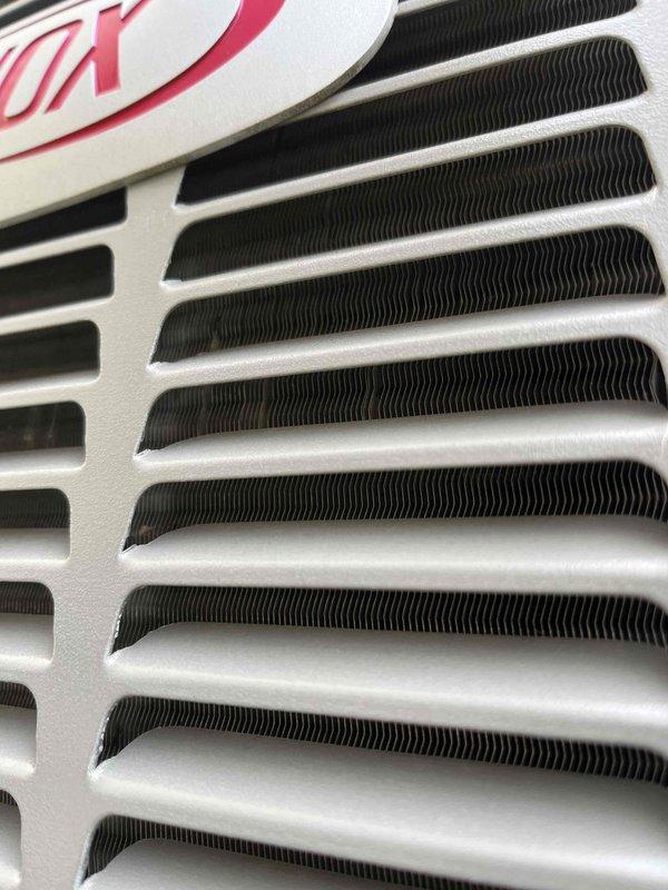 Completed annual cooling maintenance on a 9-year-old air conditioning system. Inspected condenser coil fins and heat exchanger components, which showed normal wear with minor dust accumulation but remained in serviceable condition. All system components were photographed for documentation, and unit was confirmed operational with no immediate repairs required.