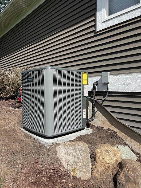 Completed full HVAC system replacement including installation of new Lennox furnace and air handler in basement utility area. Installed two exterior condensing units on concrete pad with proper refrigerant line sets, electrical conduit, and PVC condensate drain lines. All ductwork connections secured, system tested and verified operational per manufacturer specifications.