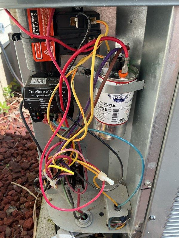 Responded to no cooling call on five-year-old residential air conditioning system affecting entire home. Upon inspection, diagnosed failed dual-run capacitor (40/5 μF, 440VAC) serving compressor and condenser fan motor. Removed defective TONGFENG ELECTRONICS capacitor and installed replacement unit with matching specifications. Verified proper electrical connections, tested system operation, and confirmed cooling restored to all areas of home. Unit returned to normal operation with proper amperage readings and temperature differential.
