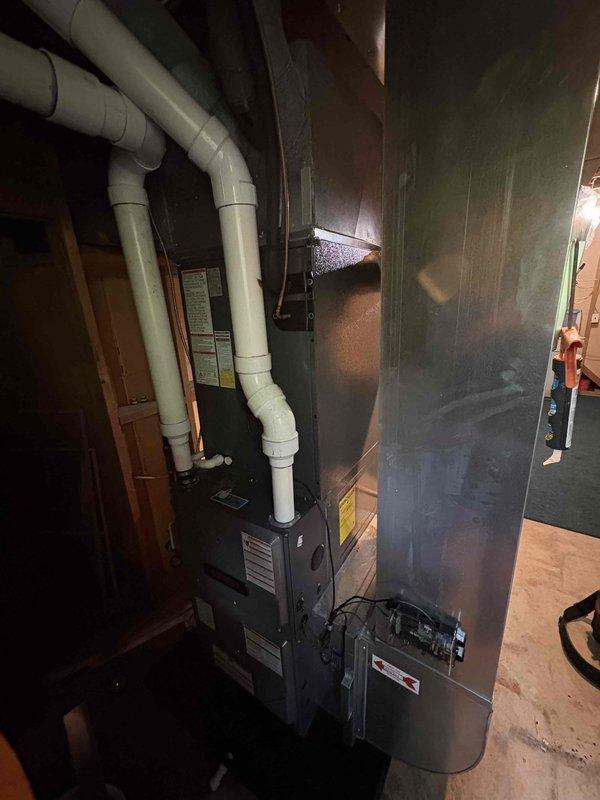 Completed full air conditioning system replacement including outdoor condensing unit and indoor air handler. Installed new outdoor unit on existing pad with proper refrigerant line connections, verified all electrical connections, and charged system to manufacturer specifications using digital manifold gauges. Installed new air handler in utility room with updated PVC venting configuration routed through ceiling space. System tested and operational upon completion.