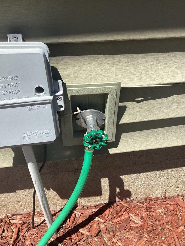 Responded to a service call for a leaking outdoor frost-proof faucet. Upon inspection, accessed the interior ceiling space where the frost-proof valve stem extends through the wall structure. Identified the source of the leak and performed necessary repairs to the faucet assembly. Verified proper operation of the exterior spigot with green cross-handle and confirmed no active leaks at both the interior connection point and exterior wall penetration. System tested and restored to full working condition.